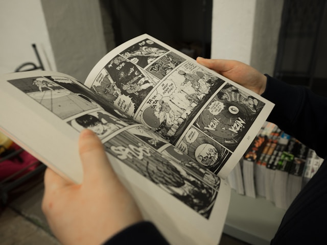 Someone reading a graphic novel