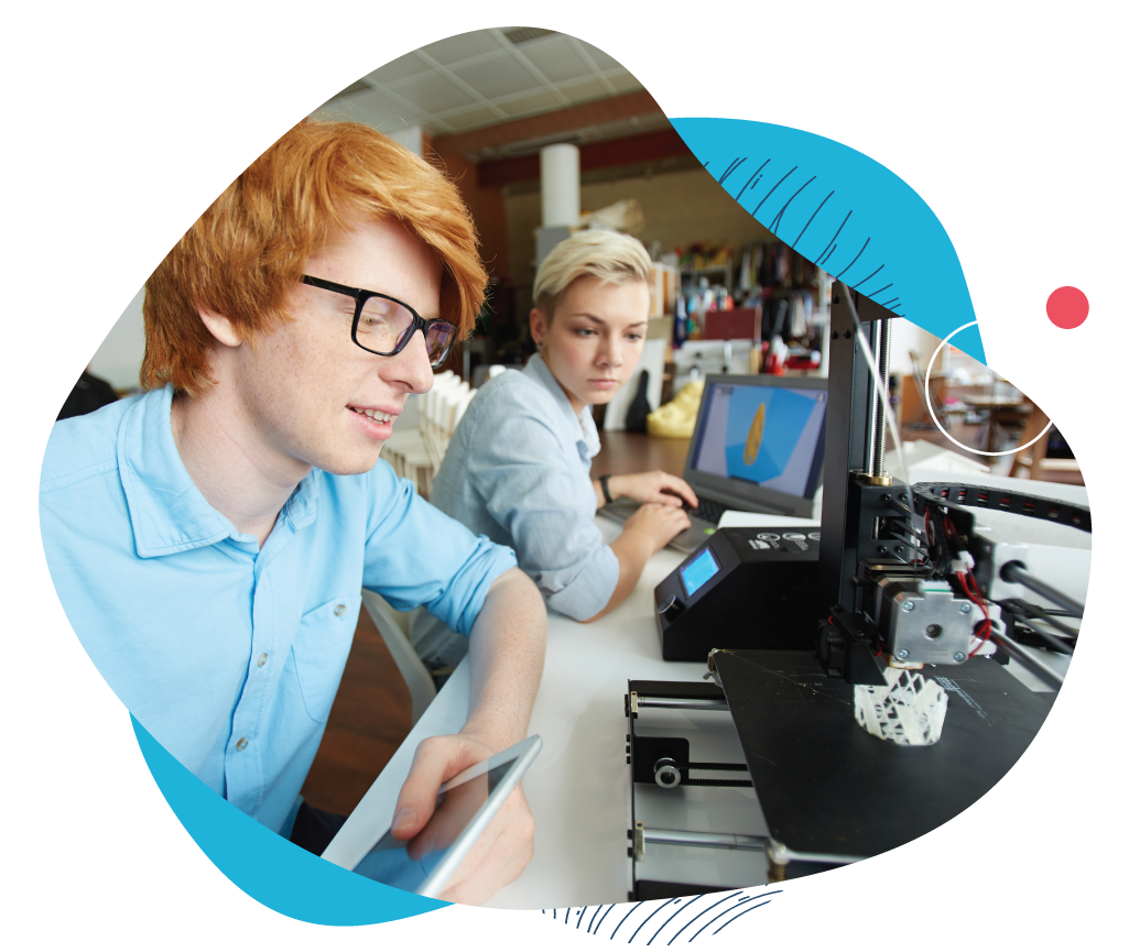 a photo of two people using a 3D printer