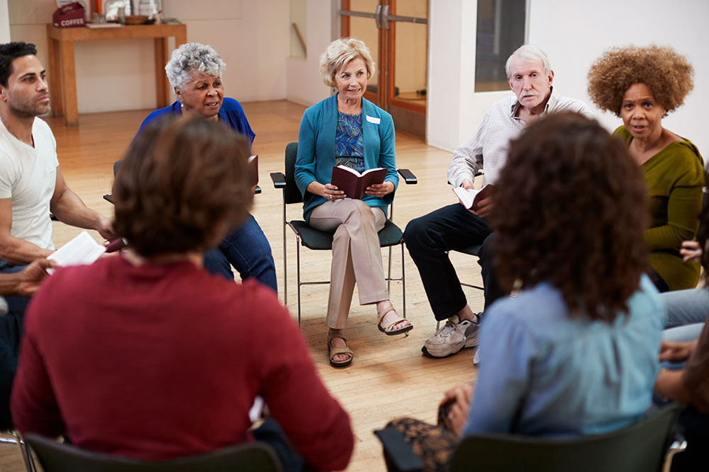 People Attending Book Group Meeting 