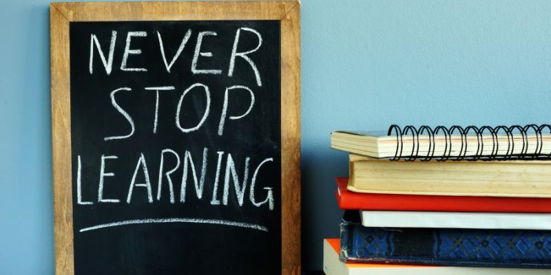 Never Stop Learning Written on a chalkboard