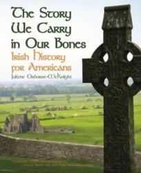 A stone cross looking over the Irish countryside